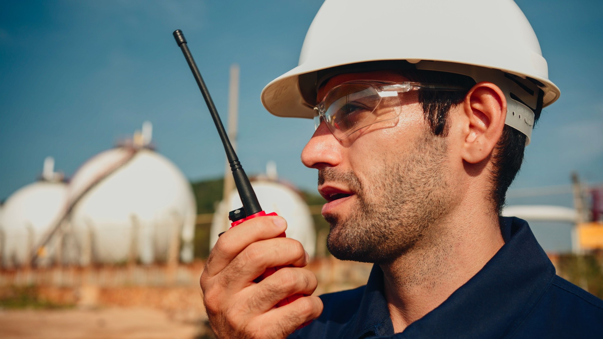 Engineer inspects the environment surrounding the oil and gas refinery.