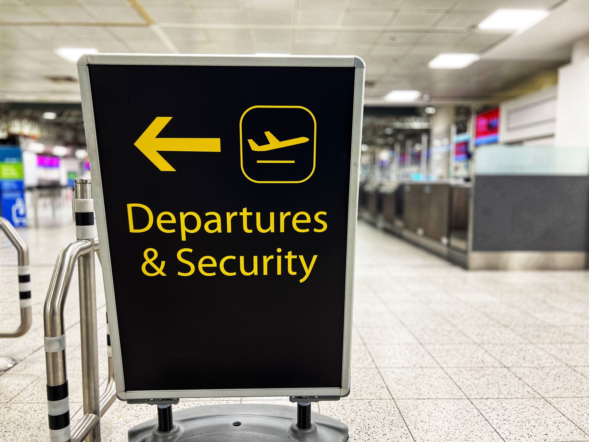 Departures and Security sign in the airport terminal